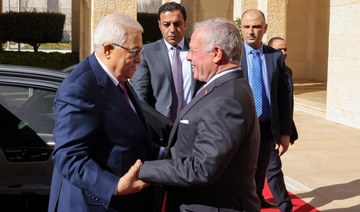 This picture shows President Mahmud Abbas (L) being welcomed by Jordan's King Abdullah II ahead of their meeting in Amman.