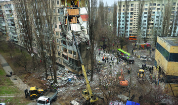 Rescuers work at a site of an apartment building heavily damaged by a drone strike, amid Russia’s attack on Ukraine, in Odesa. 