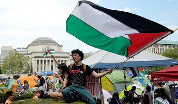 Protestors wave Palestinian flags on the West Lawn of Columbia University on April 29, 2024 in New York. (AFP)