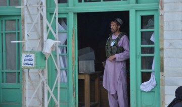 A gunman kills 6 worshippers inside a Shiite mosque in western Afghanistan, the Taliban say