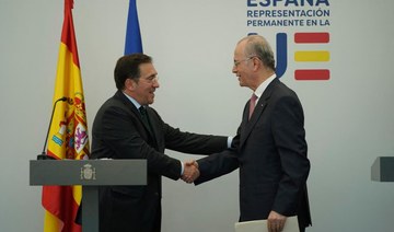 Spanish Minister for Foreign Affairs, European Union and Cooperation, Jose Manuel Albares (L) shakes hands with Palestinian PM.