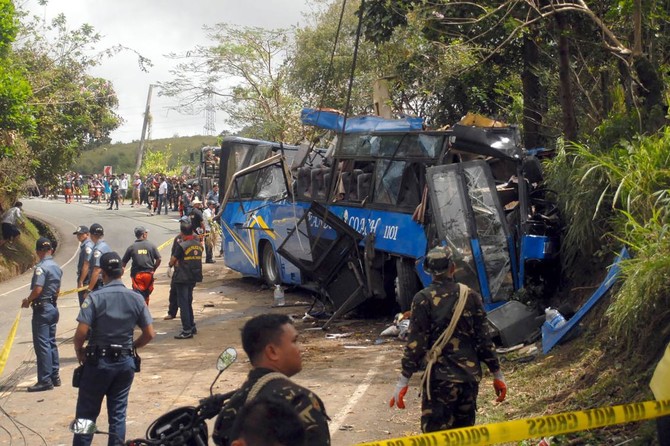 At least 14 killed in Philippine bus crash
