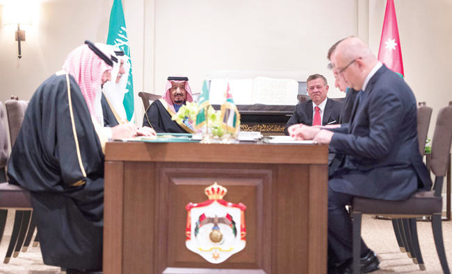King Salman, King Abdallah witness signing of key pacts in Amman