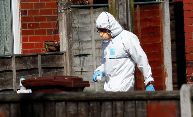 UK police arrest man, raid properties in suicide bombing probe