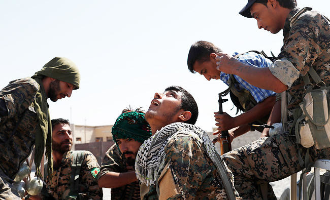 Spirits high among Kurds as coalition battles for Raqqa