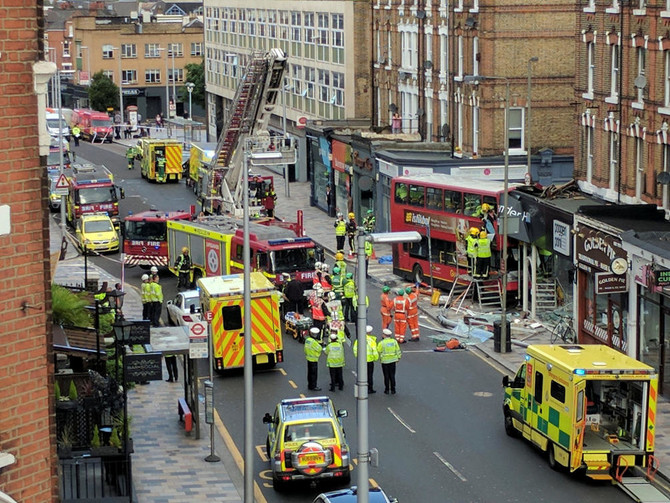 London double-decker bus crashes into store, several hurt