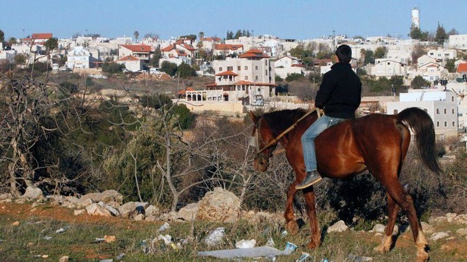 Israel freezes controversial settlement law