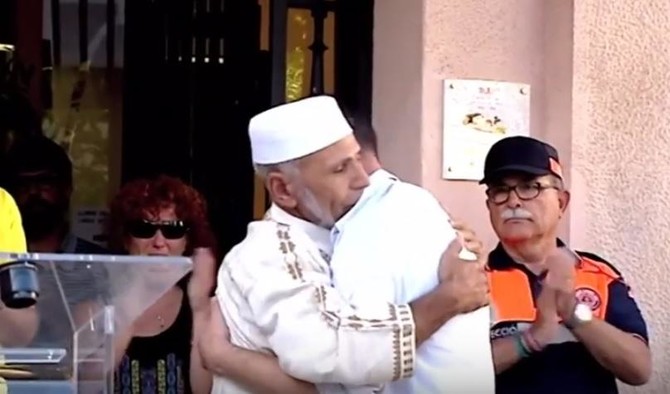 Watch: Father of three-year-old Barcelona attack victim hugs local imam