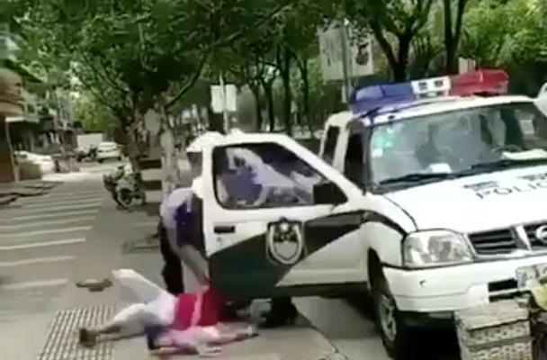 Shanghai punishes cop who downed woman, child in parking ticket row