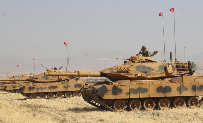 Turkish tanks drill on Iraqi border week as Kurdish vote nears