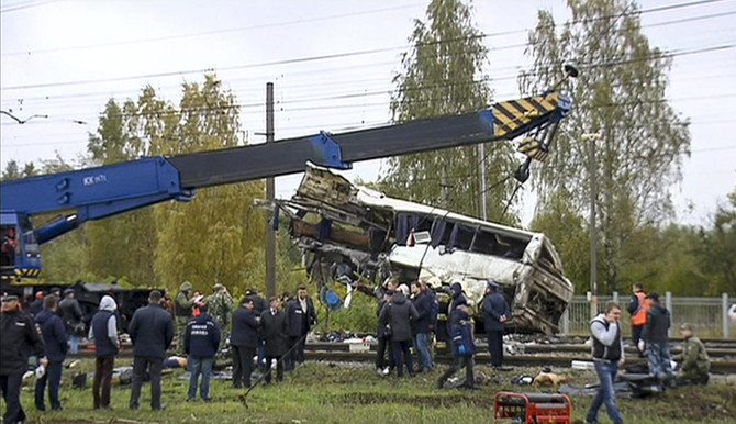 At least 16 killed as train hits bus in Russia