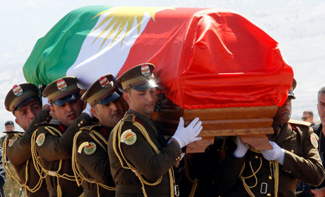 Kurdish flag sparks controversy at former Iraqi president’s funeral