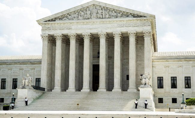 US Supreme Court throws out travel ban ruling
