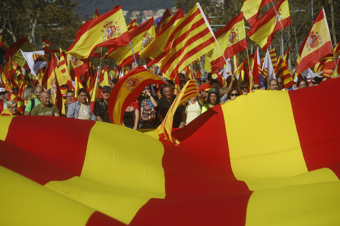 Hundreds of thousands march for unified Spain, poll shows depths of division