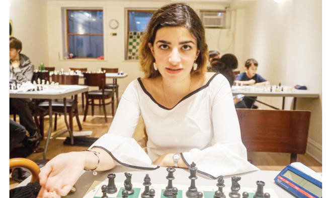 Dumped Iranian chess star fights back into the game