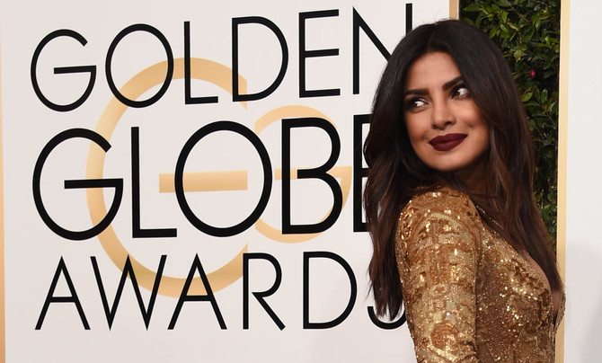 Hollywood gets party season started at glitzy Golden Globes