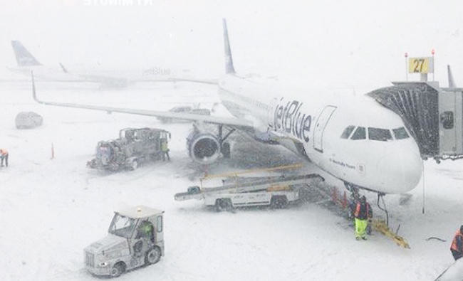 New York airport terminal flooded as brutal cold grips US East Coast