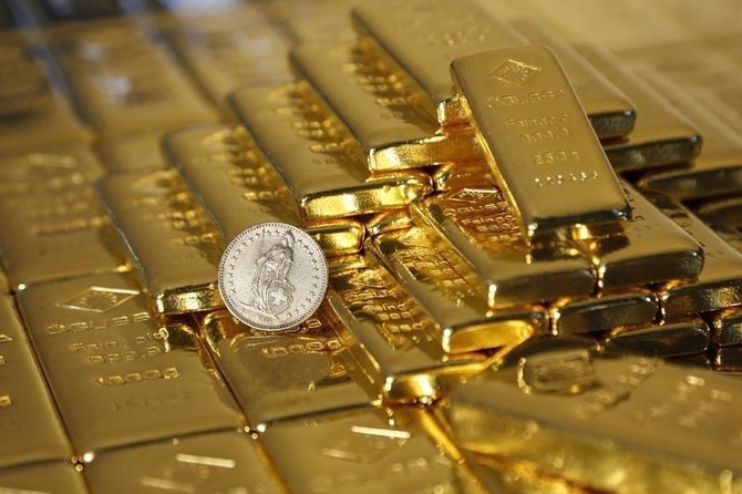 Gold price holds near four-month highs despite stronger dollar