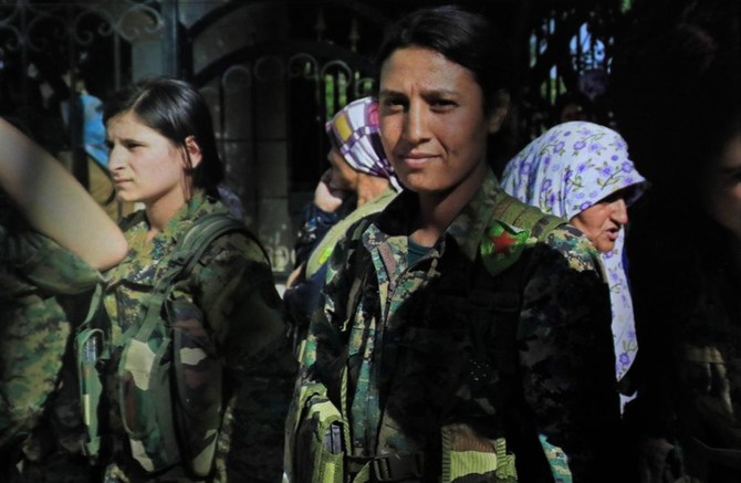 Syrian Kurds mourn female fighter shown mutilated in video