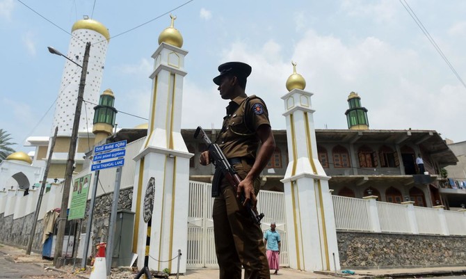 Muslims pray under military protection in Sri Lanka after riots