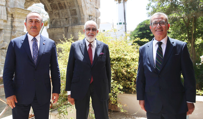 From left,Turkey's Foreign Minister Mevlut Cavusoglu, Libya's Foreign Minister Tahir Siyala and Evarist Bartolo, Minister for Foreign and European Affairs of the Republic of Malta, pose for a photo following their talks, in Tripoli, Libya, Thursday, Aug. 6, 2020. (AP)
