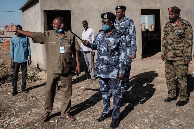 Local police and army officials inspect Village Eight transit centre which hosts Ethiopian refugees who fled the Ethiopia's Tigray conflict near the Ethiopian border in Gedaref, eastern Sudan, on December 2, 2020. (File/AFP)