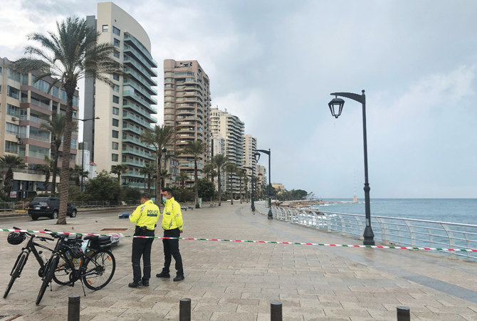 Police officers patrol Beirut’s seaside Corniche as Lebanon tightened lockdown and introduced a 24-hour curfew to curb the spread of COVID-19 infections. (Reuters)