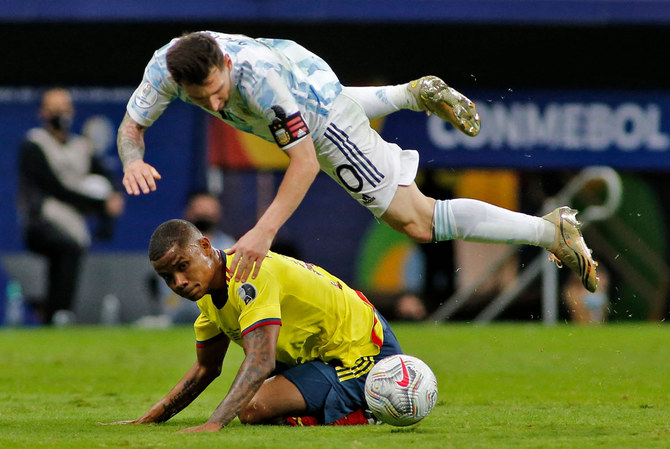 Argentina's Lionel Messi (top) and Colombia's Wilmar Barrios vie for the ball during their Conmebol 2021 Copa America football tournament semi-final match in Brasilia, Brazil, on July 6, 2021. (AFP)