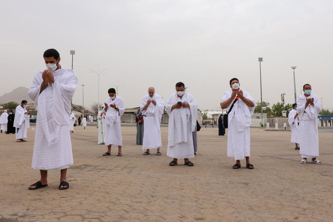 Masked Hajj pilgrims on Mount Arafat pray for COVID-free world