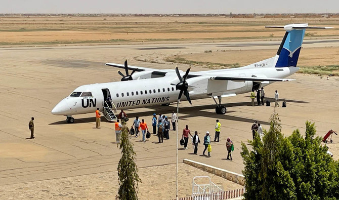 Ethiopian former peacekeepers, deployed to the Abyei region, disembark off a United Nations' Embraer E190 aircraft as they arrive in Sudan’s Kassala airport on May 15, 2022, after seeking asylum. (AFP)