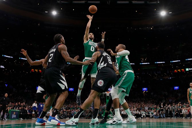 Jayson Tatum of the Boston Celtics shoots the ball against the