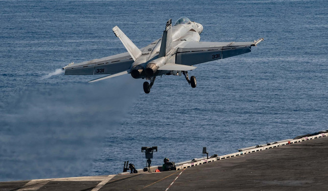 This handout picture courtesy of the US Navy released on October 15, 2203 shows an F/A-18E Super Hornet attached to the 