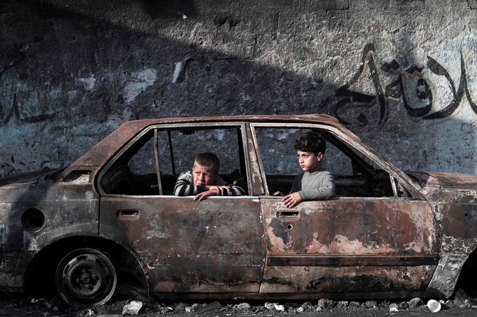 Children sit in a destroyed car in Rafah, on the southern Gaza Strip on February 28, 2024, amid ongoing battles between Israel and the Palestinian militant group Hamas. (AFP) New Zealand designates entirety of Hamas a ‘terrorist entity’