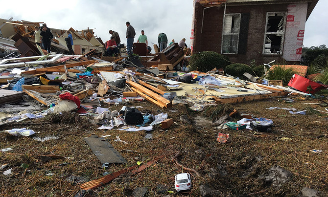 Powerful storms kill at least 18 in southeast US