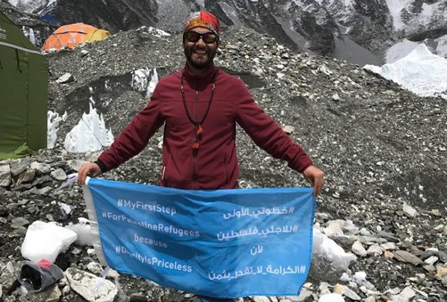 Palestinian refugee-amputee climbs Mount Everest to save UNRWA school