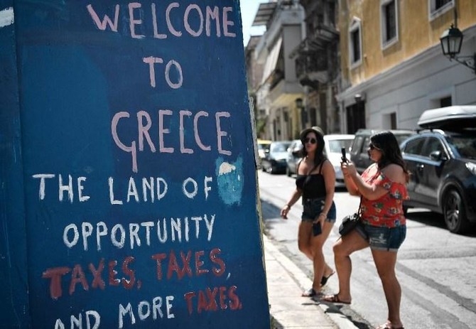 Greek Prime Minister heads to Odysseus’ home at end of bailout journey