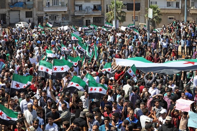 Defying dangers, Idlib residents protest Syria’s Assad