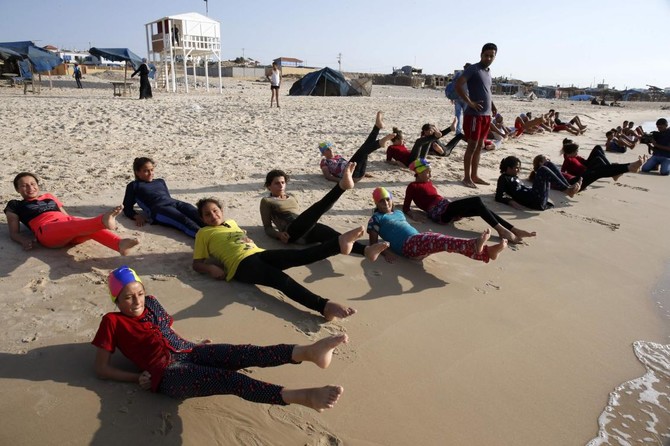 Olympic dreams: Palestinian swim team braves pollution to train in Gaza waters