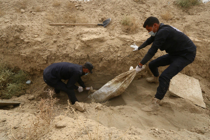 One year on, Syrians in Raqqa exhume their dead for reburial