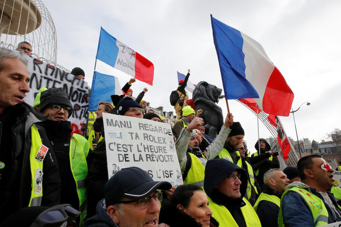 French ‘yellow vests’ march through Paris denouncing police violence
