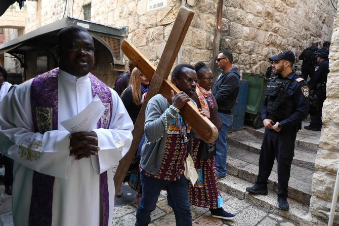 Christian pilgrims march through Jerusalem for Good Friday