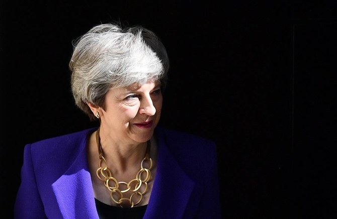 Britain’s May should set resignation date next week: senior lawmaker