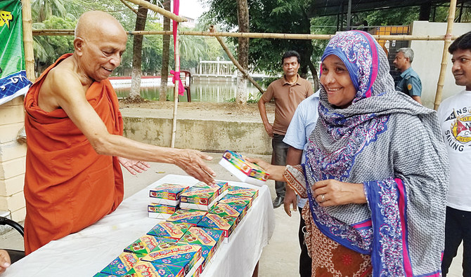 Taste of kindness: Buddhist monks serve iftar at a Dhaka monastery
