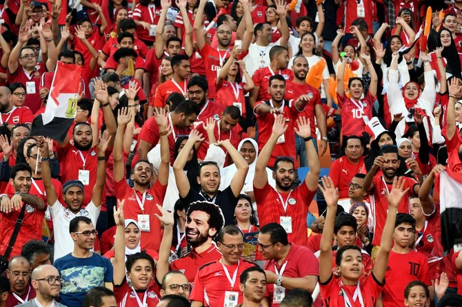 Egyptians light up stadium in tribute to fallen fans