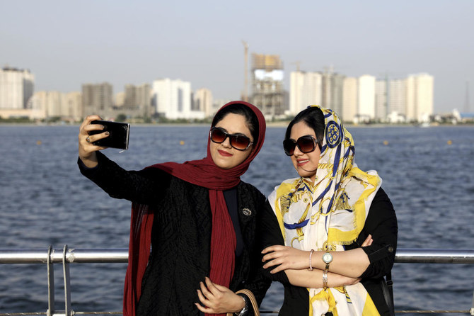 Iranian women take off their hijabs as hard-liners push back