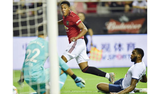 Man United win in Shanghai  but lose Bailly to injury