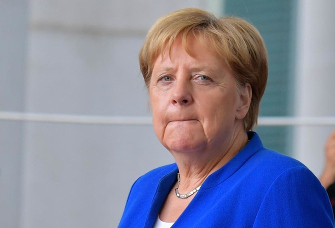 Merkel warns of Brexit economic pain before Johnson visit