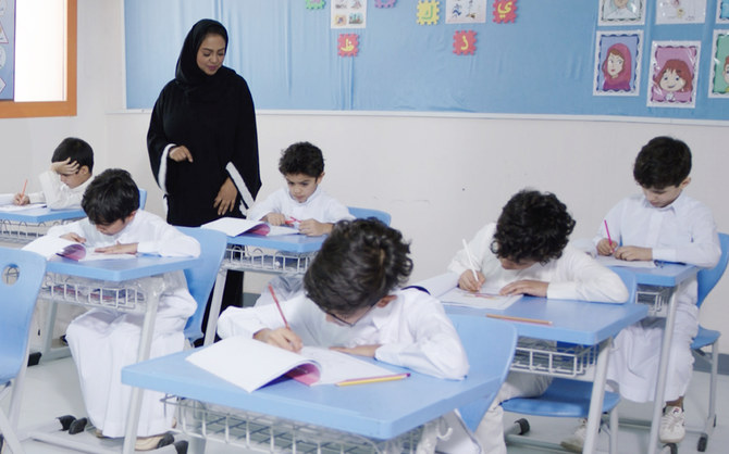 Women teach young boys for the first time in Saudi public schools