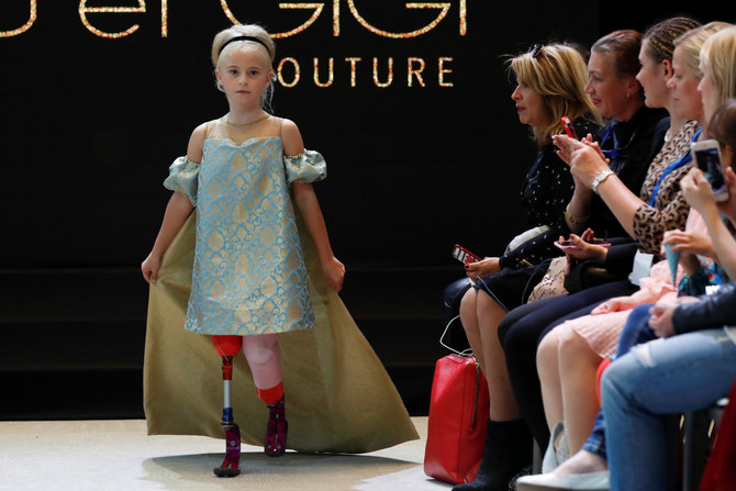 Double amputee girl debuts on Paris fashion catwalk