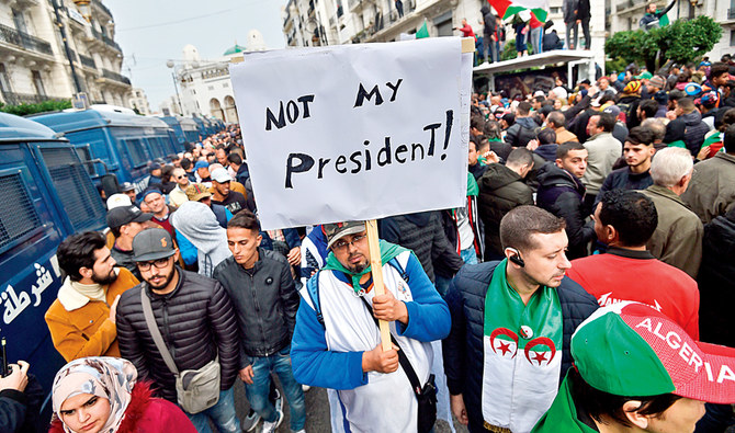 Untiring protesters come up against elite in Algeria